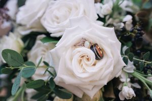 rings in bouquet. wedding details. ring shot. black and white wedding. bouquet. bride and groom.